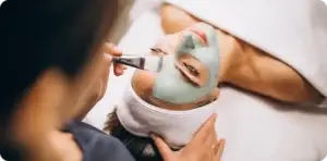 Beautician applying makeup during a retail beauty service